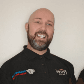 Dave, smiling, in his work polo shirt